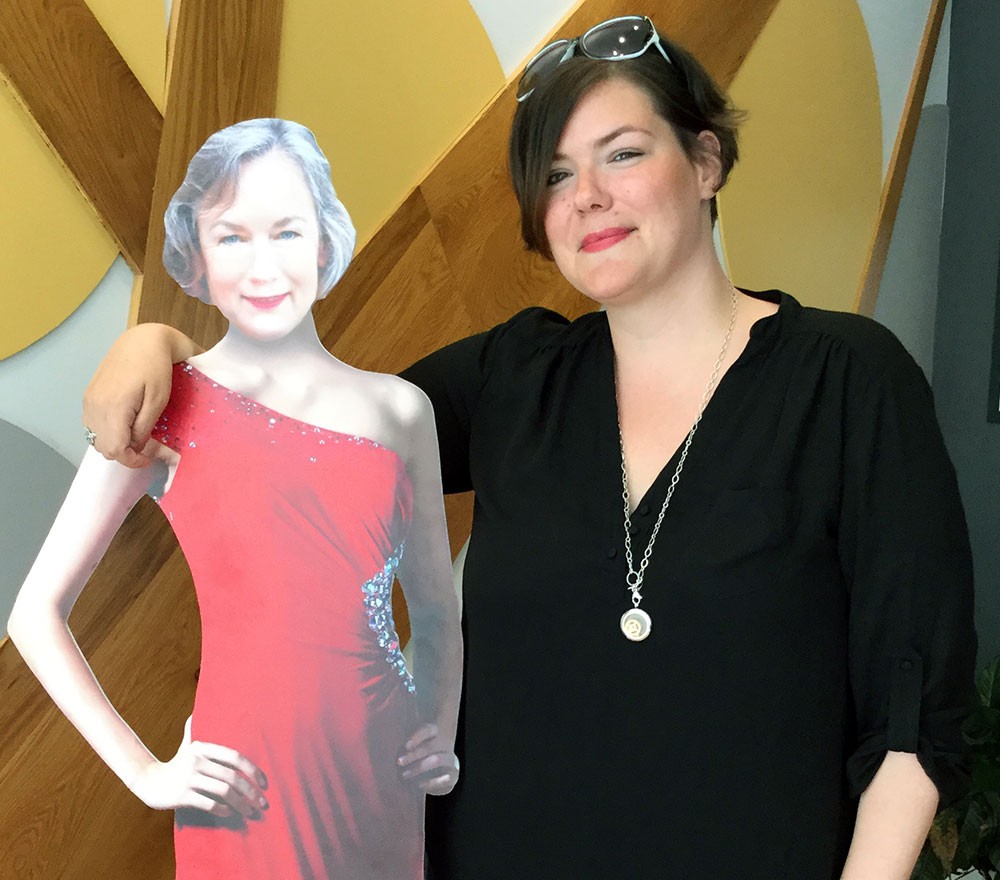 Sarah Grace and Mackey McNeill cutout Sarah Grace of Mackey Advisors with cardboard cutout featuring Mackey McNeill's headshot