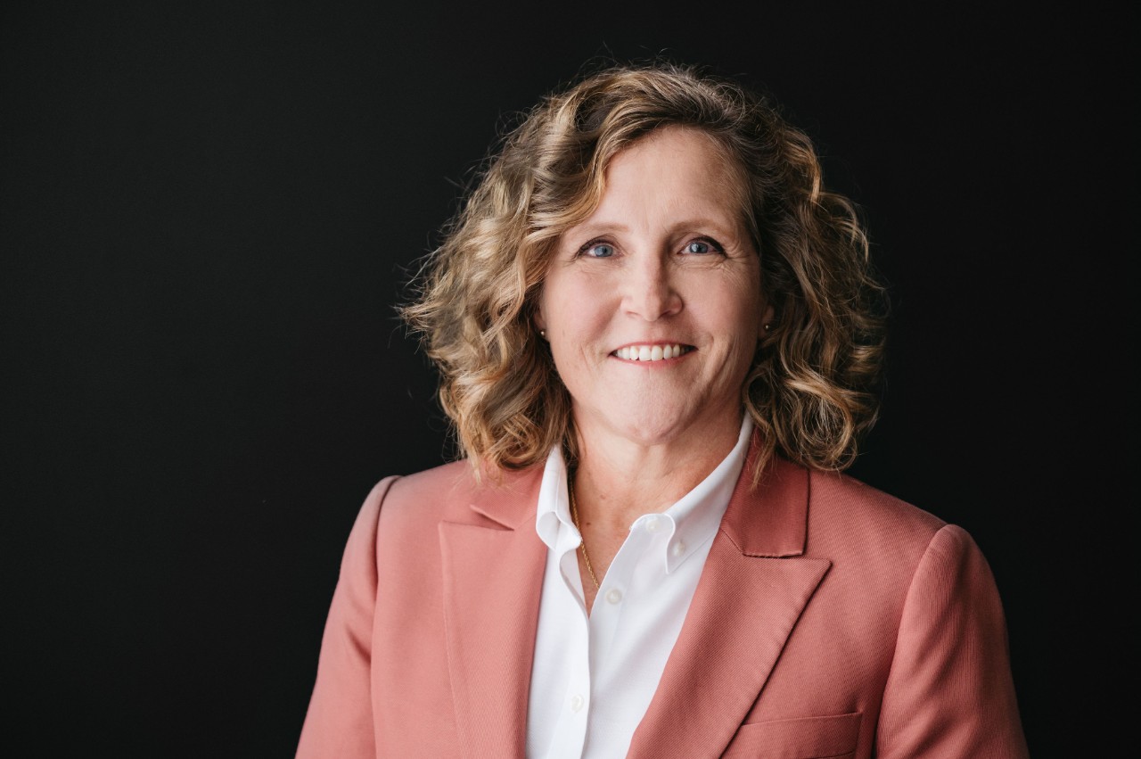 Marianne Lewis in a pink blazer and white shirt.