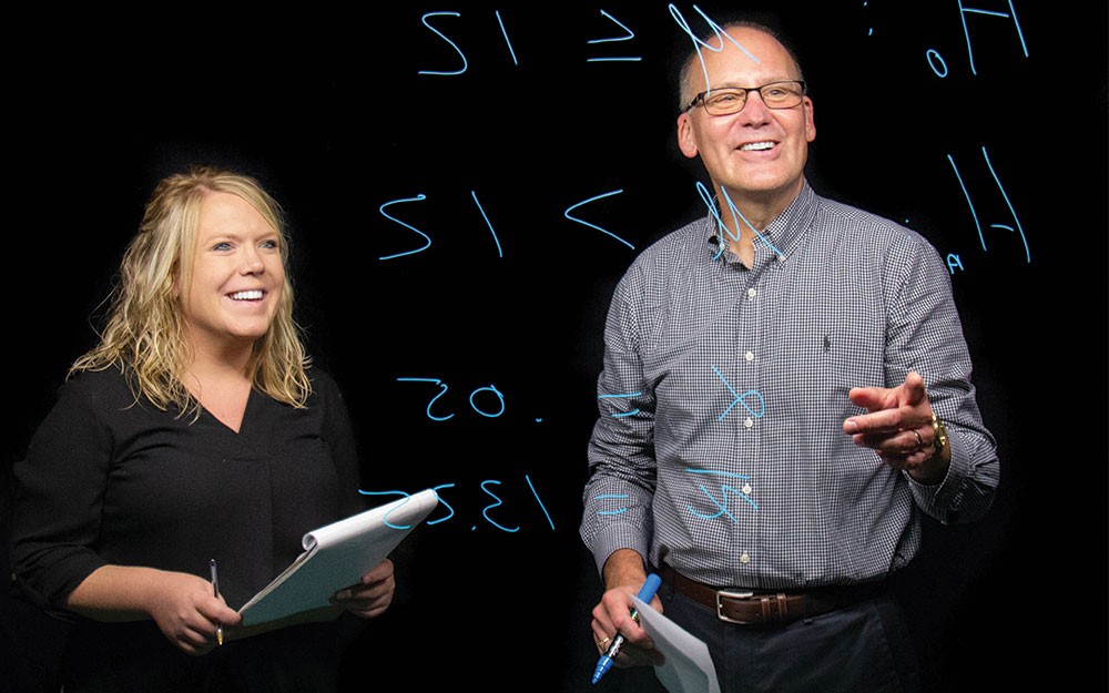 Portfolio 2018, Calhoun and Winkofsky at lightboard Danielle Calhoun, left, and Ed Winkofsky using a lightboard